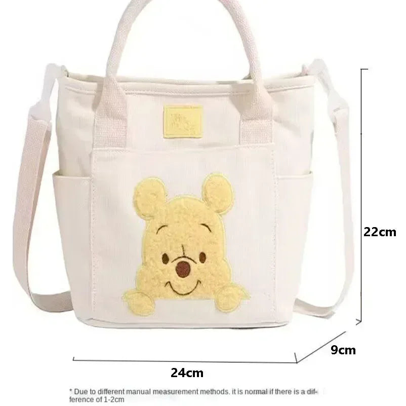 2024 New Disney Cute Cartoon Winnie the Pooh Canvas Crossbody Bag Doll Portable Handheld Crossbody Two-Purpose Bag