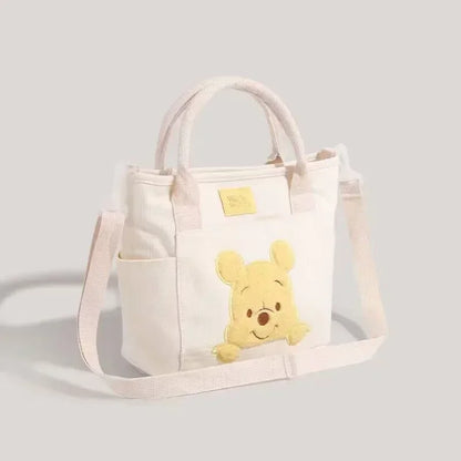 2024 New Disney Cute Cartoon Winnie the Pooh Canvas Crossbody Bag Doll Portable Handheld Crossbody Two-Purpose Bag