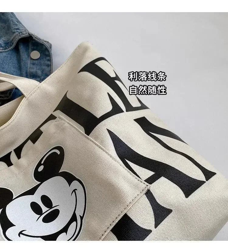 Disney Large Capacity Canvas Bag Women's 2025 New Mickey Cartoon Versatile Shoulder Bag Student Class Commuting Tote Bag