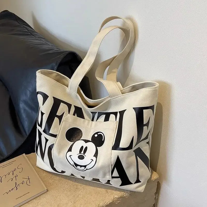 Disney Large Capacity Canvas Bag Women's 2025 New Mickey Cartoon Versatile Shoulder Bag Student Class Commuting Tote Bag