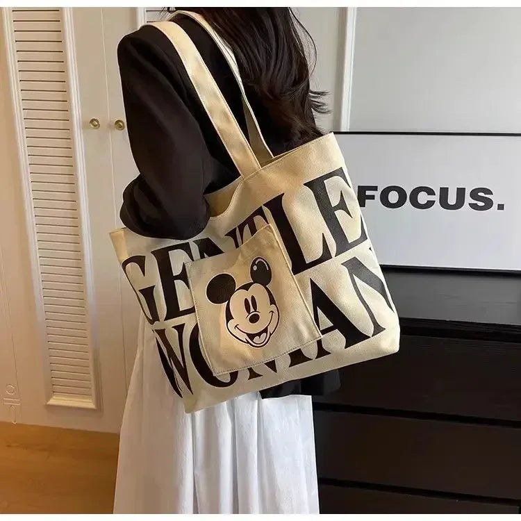 Disney Large Capacity Canvas Bag Women's 2025 New Mickey Cartoon Versatile Shoulder Bag Student Class Commuting Tote Bag